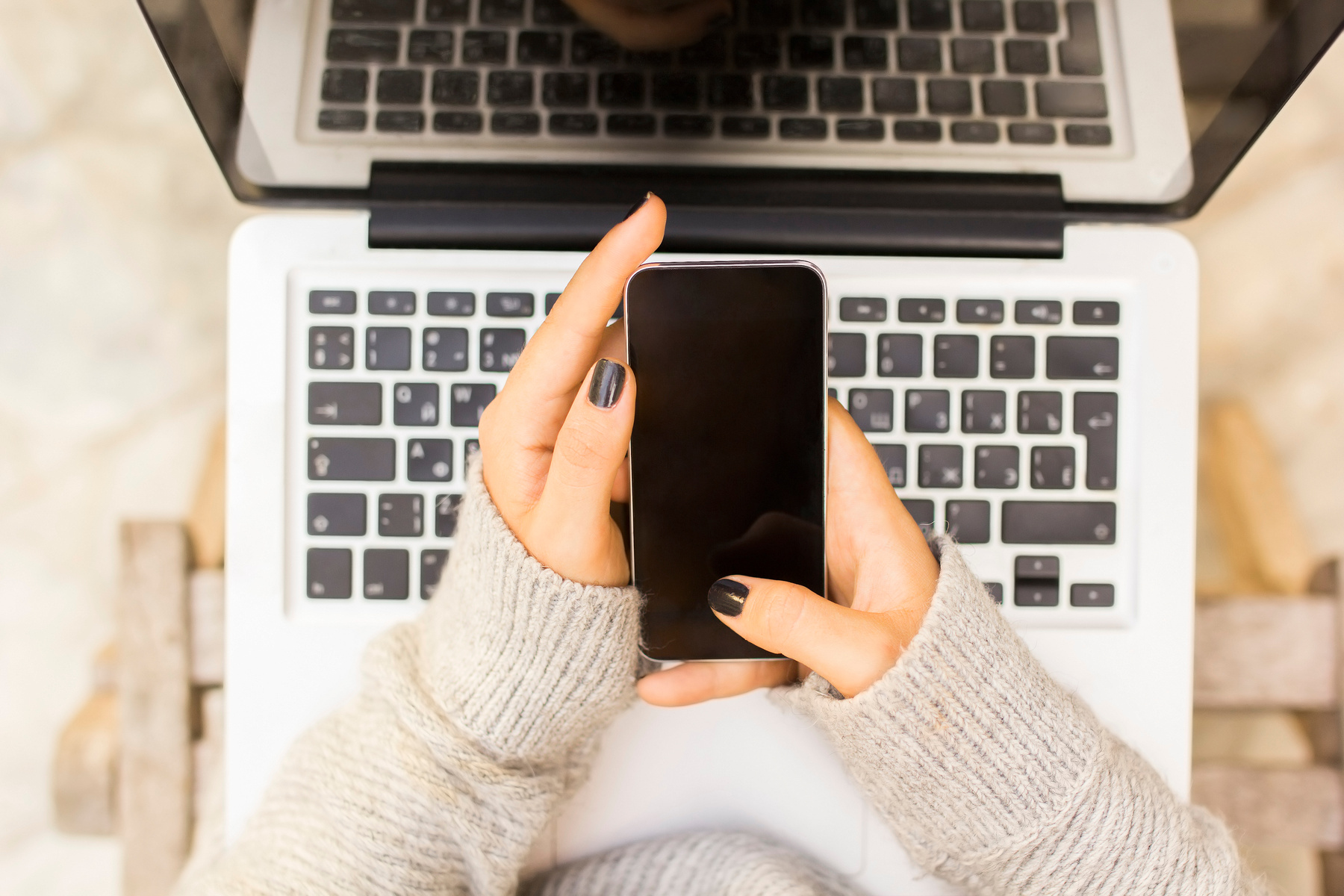 Girl with cell phone and laptop